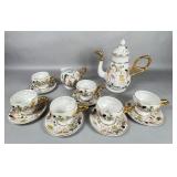 Porcelain Cherub Embossed Tea Set with Gilt
