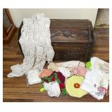 Carved Wood Chest with Assorted Linens