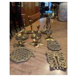 Grouping of brass candle holders and trivets