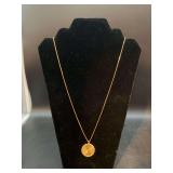 14K yellow gold 24” chain with 14K yellow gold medallion…..10 grams