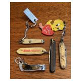 Grouping of 5 advertising knives and 1 advertising clippers….black handled and gold tone with Tweety  Bird will not open