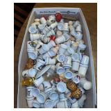Large collection of ceramic, porcelain, brass and other material thimbles…..too many to take individual pics so please see sampling pics…..also includes small 6-slot display