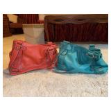 (2) Tignanello genuine coral and teal pebbled leather shoulder bags…..coral has a tag with 280812…..teal is 281212