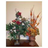 (2) composite material urn-style planters with artificial florals…..6 and 6-3/4” tall