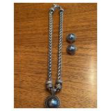 Silver tone braided chain necklace with gray bead pendant and matching clip-on earrings