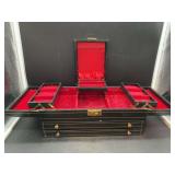 Vintage black leather-like jewelry box with hinged top storage and 2 drawers