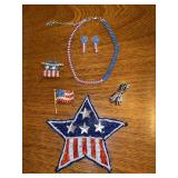 Grouping of both vintage and modern patriotic jewelry…..ribbon pendant of right honors the heroes from 9-11 and huge star is a pin