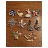 Elegant grouping of gold tone brooches
