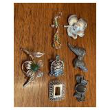 Elegant grouping of silver toned brooches