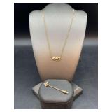 (2) very nice 14K yellow gold jewelry pieces…..choker length mushroom necklace and decorative stick pin with clear stone…..5 grams total