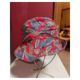 Headliner brand bucket-style hat with hat pin on one side