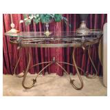 Heavy wrought iron half moon glass top table...52" long x 17-3/4w x 28" tall