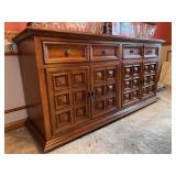 MCM Brutalist-style sideboard or buffet featuring distinctive paneled doors with a geometric, block-like pattern and 4 drawers
