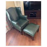 Green leather wingback chair with ottoman
