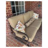 Three cushion glider with pillows