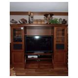 Hooker Entertainment Center 23X76.5X21. Each side shelf is 23" wide.      Center shelf and top piece removable...Contents inside and on top not1 included. TV Stand and TV in Center not included.