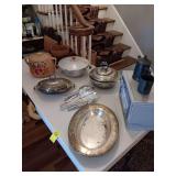 Group of miscellaneous serving pieces and a set of silverplate flatware.