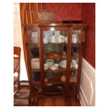 Tiger Oak Curio Cabinet.
 Has 5 wood shelves 38X57X14.5.
