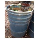Empty blue metal barrel 35 inches by 24 inches.