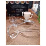 Pink 2 handled milk glass dish.
 Also 2 plastic and one glass ladle.
