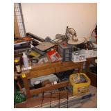 Work bench. 69x32x24 Includes ALL contents on top, inside, and below with exception of flooring.  See photos ..Untested