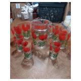Great condition Red Tulip pitcher with ice lip. Has six drank and three juice glasses.