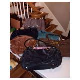Group of purses includes 1 Coach bag.