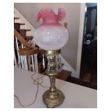 Very Pretty Fenton Cranberry Brass Lamp. Needs cleaned been stored in attic. Top piece for bulb does need tightened. See photos