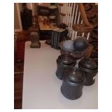 Very nice group of home decor. Bookends with John Grisham Books, Urn with decorative balls, 3 Brown canisters and a red lidded vase. See photos