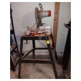 Rigid ten inch compound miter saw on stand back left leg is bent on stand.