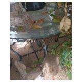 Rod Iron Table with beveled glass 21"x19"round.. glass does have a small chip in back as shown
