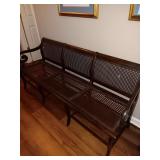 Vintage Cane back and bottom bench..very cute. Has 2 small damaged spots on back as shown in photos. 60x31x22