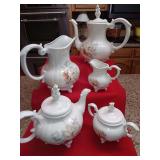Loma 8 piece ceramic floral set. Tea, coffee pot, cream and sugar bowl and water pitcher. Good condition. No crazing.