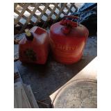 2 gas cans. 1 is metal
