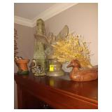 Decor items on top of bookcase. See photos