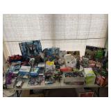 Table of misfit toys…..missing parts, blister packs not attached, some new, some used…..a wide variety