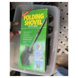 The two folding shovels with a saw in the handle