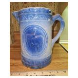 Vintage 8" tall blue & white salt-glaze stoneware pitcher grazing cows pattern good vintage condition w/crack across bottom...