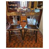 Pair of Vintage 19th Century Style Ebonized and Paint-Decorated American Plank Seat Chairs Measure 15.25" seat w x 13.5" seat d x 18" seat back h x 17" seat h x 33" total h in excellent, sturdy vintag