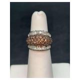Sterling silver ring with wide rows of amber colored stones surround by baguettes on each side….size 5…..6 grams