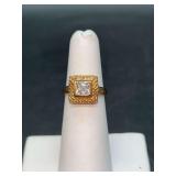 Very nice gold tone over sterling ring with rhinestone center…..size 5…..3 grams