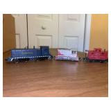 (3) random train cars…..locomotives and caboose (caboose is plastic