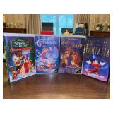 (4) Walt Disney Classic VHS Tapes….2 in the center are Black Diamond but cases are in used condition