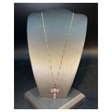 Dainty gold tone over sterling chain with JCM IOM cross filled with gorgeous lavender stones