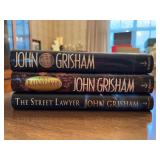 (3) volumes of John Grisham novels…..all are hardback with dust jackets