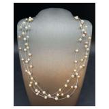 4 individual strands of floating pearls…..there was a note that they are cultured pearls but no other verification
