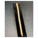 Sterling Silver Gold Tone Tennis Bracelet with clear stones throughout…..6-3/4”