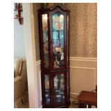 Gorgeous Lighted Corner Curio Cabinet with mirrored back…..69” tall…..OTHER CONTENTS NOT INCLUDED