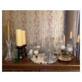 Grouping of various style and size candle holders