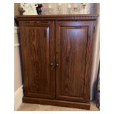 Nice looking wood VHS (or other) storage cabinet…..31-1/4 x 12 x 39 tall…..CONTENTS ON TOP NOT INCLUDED….no key